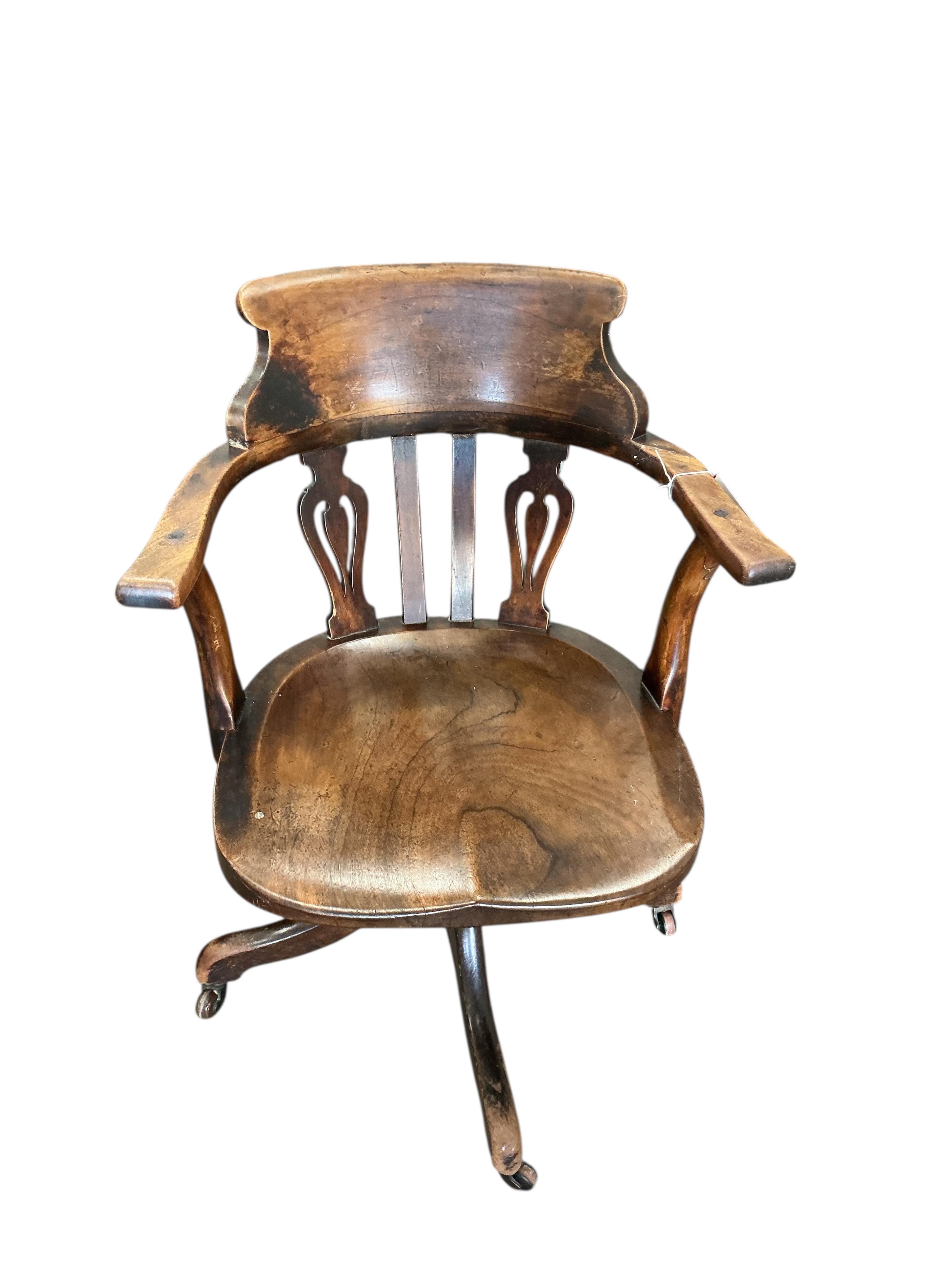 A Victorian mahogany swivel desk chair with saddle seat, width 59cm, depth 48cm, height 81cm
